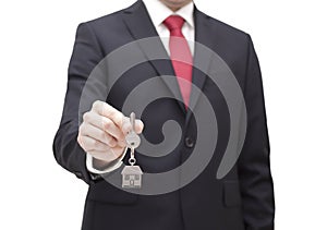 House key in businessman hand