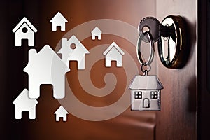 House key in the door. Symbol, chrome
