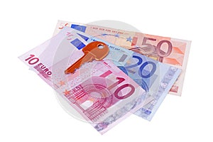 House key and euro banknotes