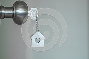 House key with home keyring in keyhole