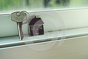 House key with home keyring, real estate concept