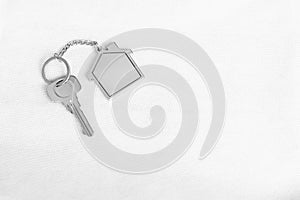 House key with home keyring in on white background