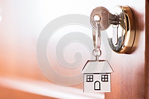 House key on a house brown door