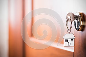 House key on a house brown door