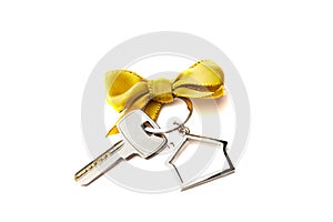 House key with red bow on white background