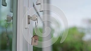 The house key for unlocking a new house is plugged into the door