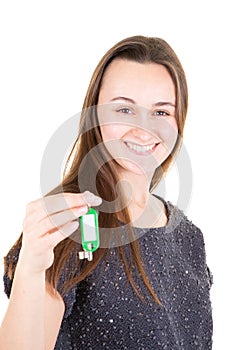 House key in young smiling woman hand