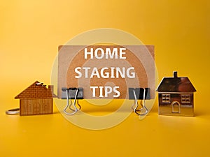 House keychain and card board with the word HOME STAGING TIPS