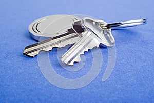 House Keys on Blue Textured Background