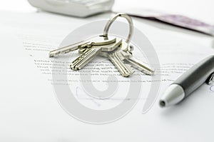 House keys on a contract of house sale