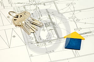 House and keys over construction plans