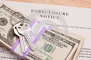 House Keys, Stack of Money and Foreclosure Notice photo