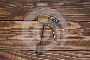 House keys on a wooden background. buying a home. rental of property