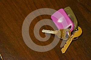 House keys on a wooden table. Mortgage concept, life event, loan and banking