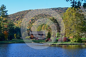 House by the lake at Glen Alton Recreation Area in autumn, photo