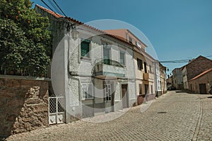 House with large balcony on deserted alley