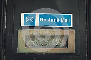House letterbox with blue  'No junk mail' sign