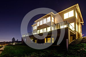 House with lights on. NIght view