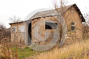 House made of clay in a village old dilapidated in Ukraine in the fall in the city of Dnipro