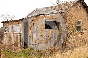 House made of clay in a village old dilapidated in Ukraine in the fall in the city of Dnipro