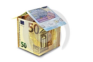 The house is made of euro banknotes on a white isolated background. Element for design. Buying and selling housing. Mortgage.