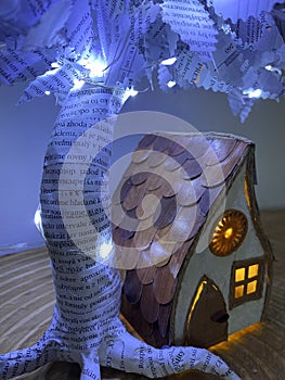 House made from paper boxes under the paper tree