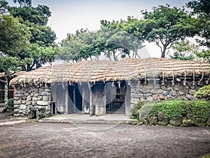 House made of valcano stone and wood structure in Seongeup Folk
