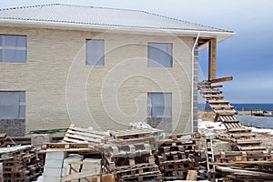 house is made of yellow silicate brick. The walls and facade of