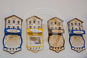 House-magnet with the name of the city. Beautiful handmade Souvenirs made of wood, traditional Turkish market. Bazaar, Turkey,