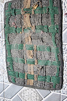 a house mat made of cloth fiber with a green and black chess pattern