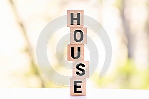 House message word on a wooden desk on cube blocks with a cash euro and dollar background. Mortgage concept