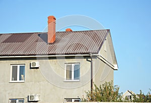 House with metal roof, brick chimney, rain gutter and insulate p
