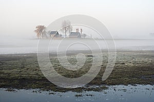 House in misty meadow