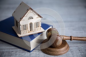 House model on book with judge