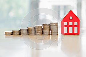 House model and coin money,mortgage and real estate