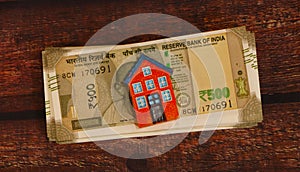 House model with Indian Currency.