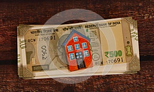 House model with Indian Currency.