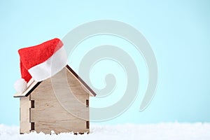 House model with red santa hat
