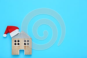 House model with red santa hat