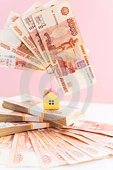 House model set on banknote for concept investment mortgage fund finance and home loan.Small wooden house on the