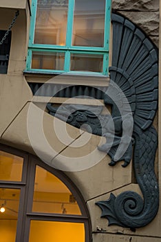 House in modern style with a bas-relief of a dragon. Streets And Old Town Architecture Estonian Capital, Tallinn