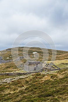 House in a mountain autumn landscape