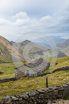 House in a mountain autumn landscape