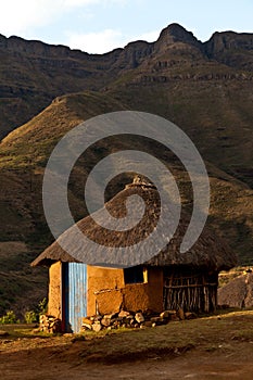 House in the mountains at sunset