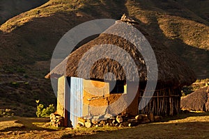 House in the mountains at sunset