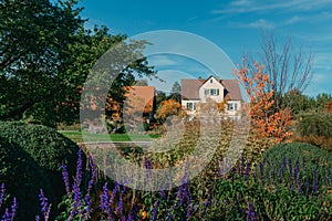 House with nice garden in fall. Flowers in the City Park of Bietigheim-Bissingen, Baden-Wuerttemberg, Germany, Europe