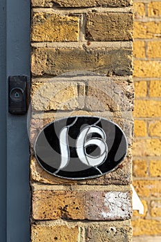 House number 16 in glass