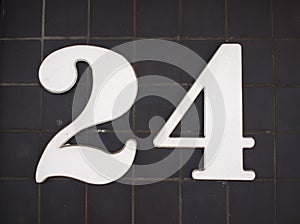 House number "24" attached to a wall