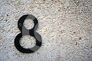 House number eight on wall