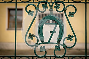 House number seven on a green iron gate